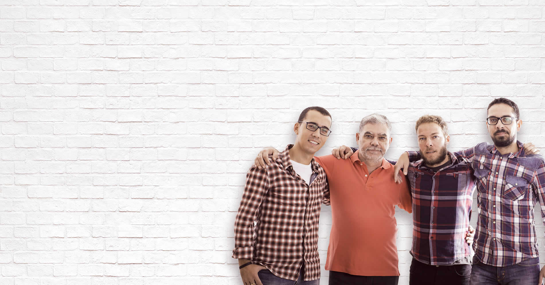 Men arm in arm looking at the camera